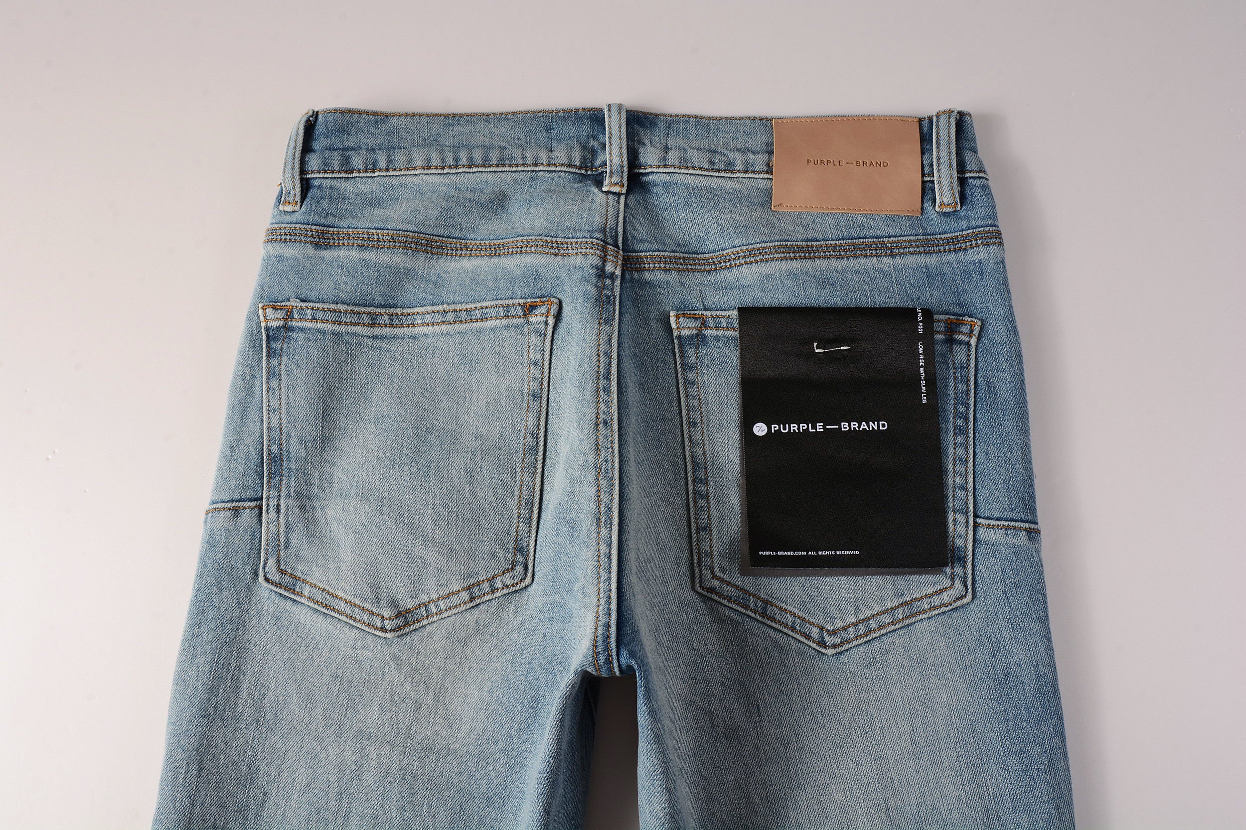 Men's Distressed Slim Fit Light Blue Skinny Jeans with Button Fly & Ripped Detailing