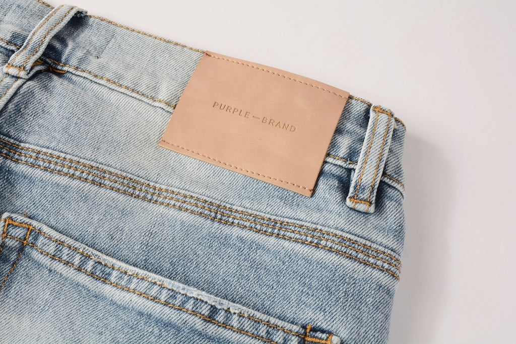 Men's Distressed Light Blue Skinny Jeans with Ripped Holes & Button Fly