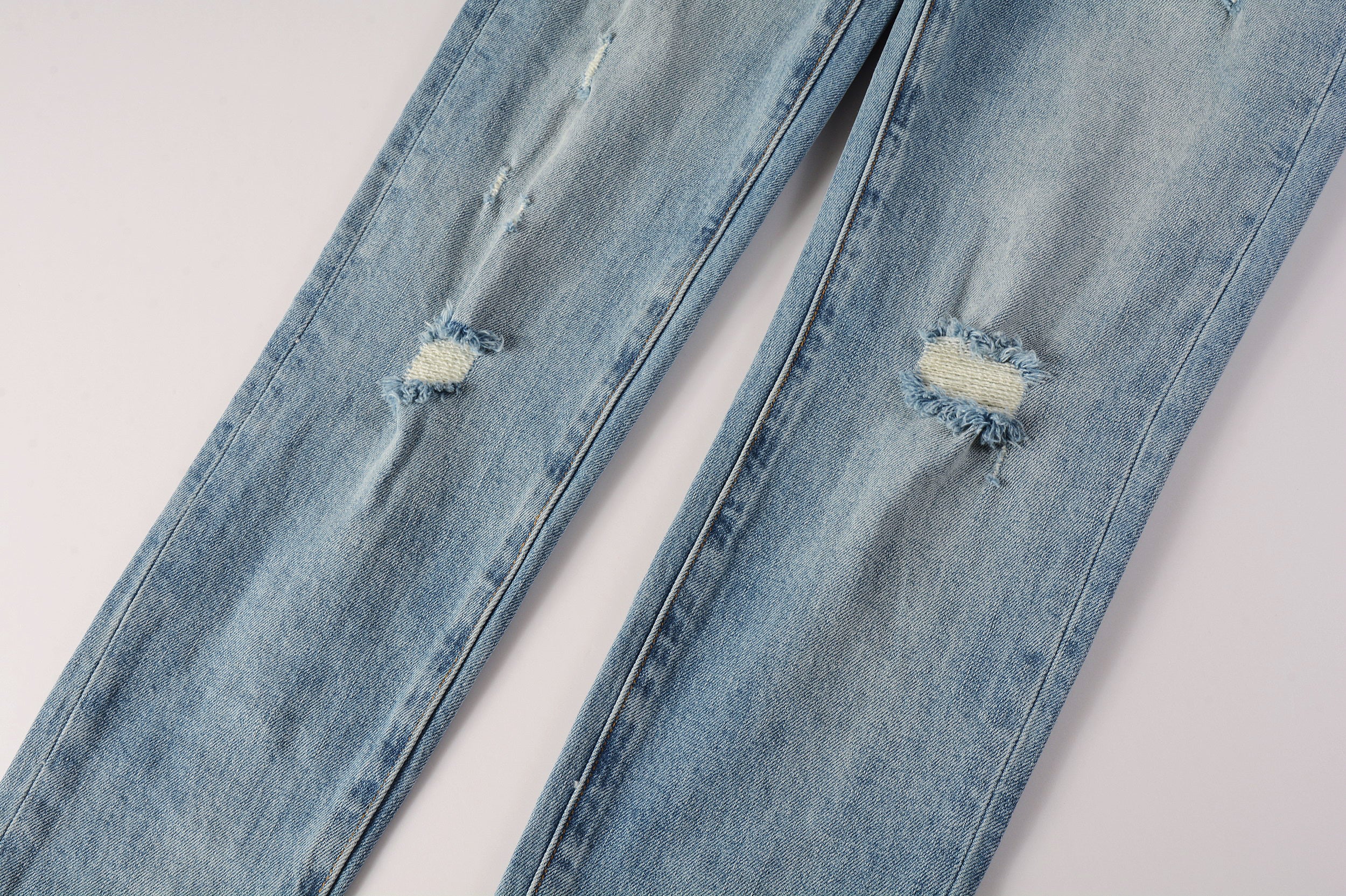 Men's Distressed Slim Fit Light Blue Skinny Jeans with Button Fly & Ripped Detailing
