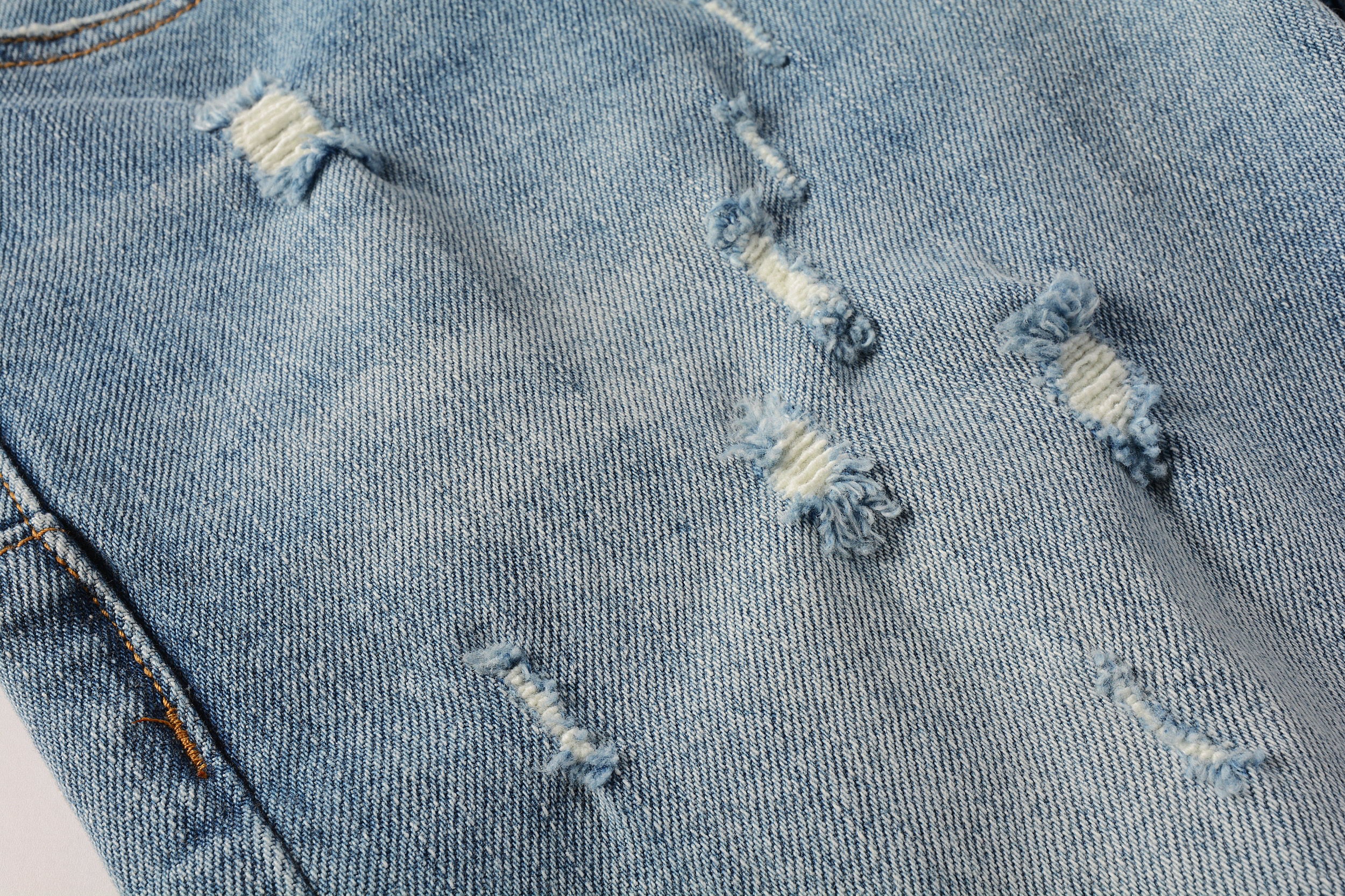 Men's Distressed Slim Fit Light Blue Skinny Jeans with Button Fly & Ripped Detailing