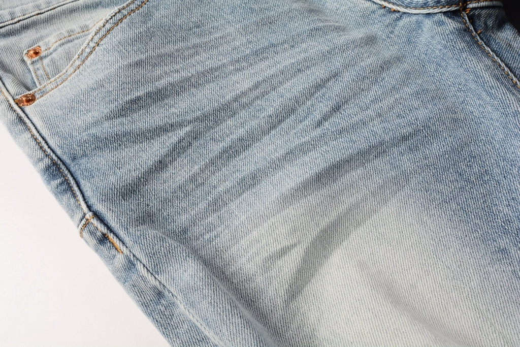 Men's Distressed Light Blue Skinny Jeans with Ripped Holes & Button Fly